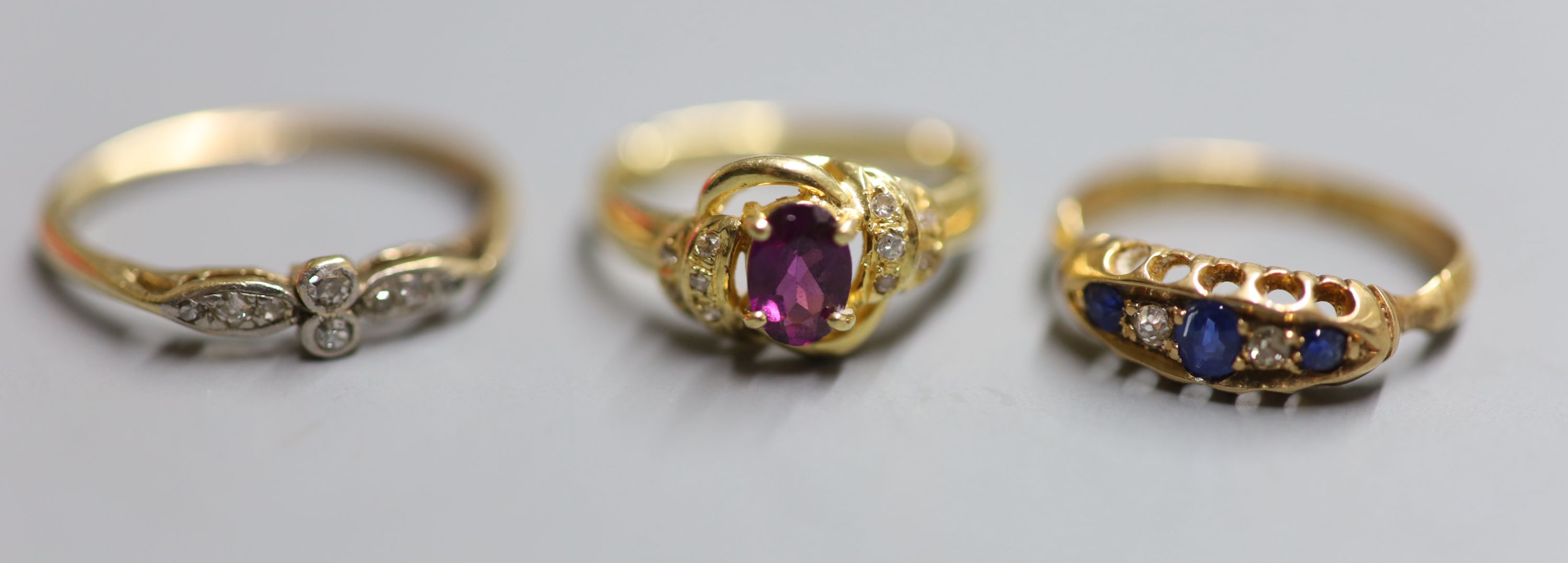 Three 18ct. rings